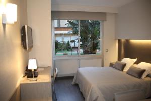 Postel nebo postele na pokoji v ubytování Aparthotel Silver + 37 fotografií