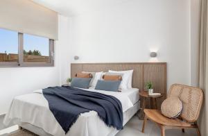 A bed or beds in a room at Anthos Villas - Chania