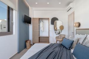A bed or beds in a room at Anthos Villas - Chania