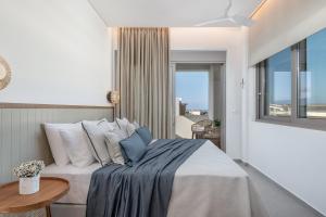 A bed or beds in a room at Anthos Villas - Chania