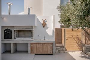A kitchen or kitchenette at Anthos Villas - Chania