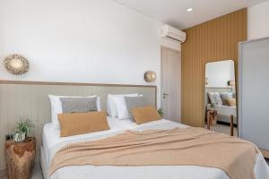 A bed or beds in a room at Anthos Villas - Chania