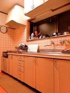a kitchen with a sink and a counter top at 4Bed Family Room Aosh ima Guesthouse Hooju Vacation STAY 13477v in Miyazaki