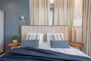 A bed or beds in a room at Anthos Villas - Chania