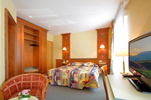 Letto o letti in una camera di Hotel Gruber