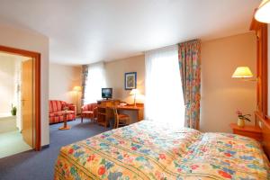 Postel nebo postele na pokoji v ubytování Hotel Gruber