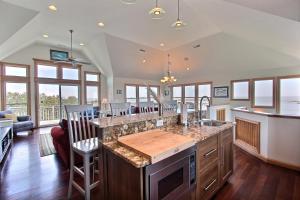a kitchen with a large island in the middle at Knock Out #3-MC in Avon