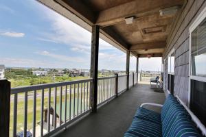 a balcony with a view of the ocean at Flip Flop Island in Hatteras