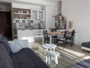 a living room with a couch and a table and chairs at the house in Poprad