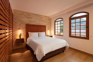 Postel nebo postele na pokoji v ubytování Casa del Balcon