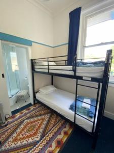 
A bunk bed or bunk beds in a room at Toad Hall Accommodation

