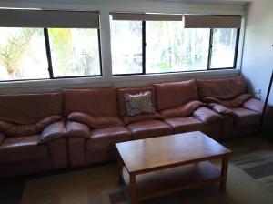 
a living room filled with furniture and a window at T's Resort & Motel in Port Macquarie
