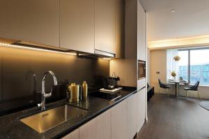 Kuchyň nebo kuchyňský kout v ubytování Pan Pacific Serviced Suites Orchard, Singapore