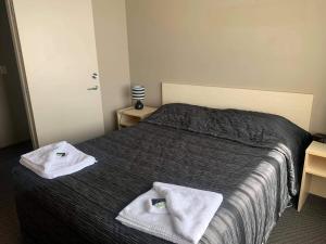 Voodi või voodid majutusasutuse Catlins Inn toas