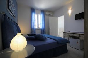 A bed or beds in a room at B&B Villa Genny a pochi passi dal mare