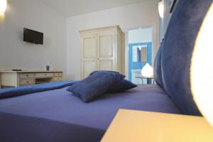 A bed or beds in a room at B&B Villa Genny a pochi passi dal mare