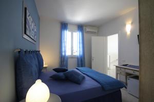 A bed or beds in a room at B&B Villa Genny a pochi passi dal mare