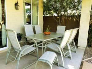 a table and chairs sitting on a patio at Phoenix home near freeways and airport in Phoenix