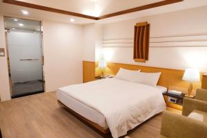Krevet ili kreveti u jedinici u okviru objekta Kao Yuan Hotel - Zhong Zheng