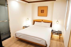 Krevet ili kreveti u jedinici u okviru objekta Kao Yuan Hotel - Zhong Zheng