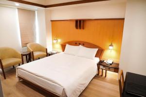 Krevet ili kreveti u jedinici u okviru objekta Kao Yuan Hotel - Zhong Zheng