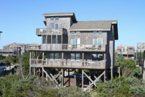 a large apartment building with a large deck at Three Sheets to the Wind #70-1 in Avon