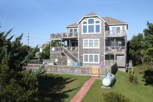 a large house with a yard in front of it at Wind Chimes #51-1 in Avon