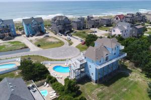 an aerial view of a house with a pool at Diamond Dunes #4-F in Frisco