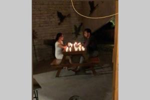 two people sitting at a table with lit candles at One 90 by the golf@kensville in Nānodra +53 photos