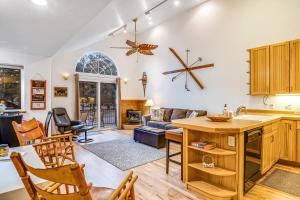 a kitchen and living room with a table and chairs at The Lakeview Escape in Pagosa Springs
