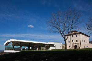 a building with a tree in front of it at Cincinnato Wine Resort in Cori
