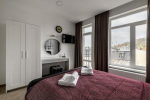 Ένα ή περισσότερα κρεβάτια σε δωμάτιο στο City Aparts Kulisha Str