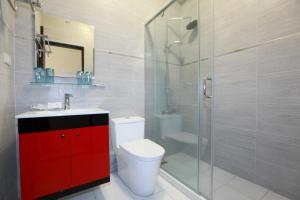 a bathroom with a toilet and a glass shower at INg Hostel in Hualien City +52 photos