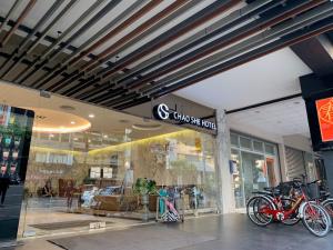 a store front with bikes parked in front of it at Chao She Hotel in Kaohsiung