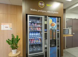 a refrigerator filled with lots of different types of drinks at B&B HOTEL PERPIGNAN Nord Aéroport in Perpignan