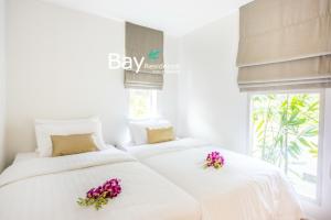 Ein Bett oder Betten in einem Zimmer der Unterkunft Bay Villas Koh Phangan