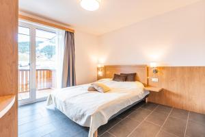 Posteľ alebo postele v izbe v ubytovaní Chalet Dorf Wagrain Alpenleben by AlpenTravel