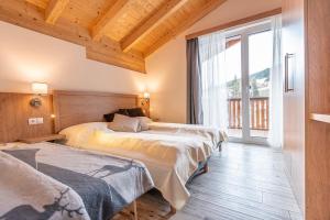 Posteľ alebo postele v izbe v ubytovaní Chalet Dorf Wagrain Alpenleben by AlpenTravel