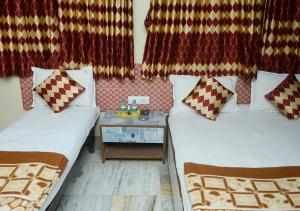 Voodi või voodid majutusasutuse SRK Hotel- Grant Road toas