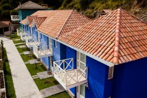 an overhead view of a blue building with a red roof at Aranwa Pueblito Encantado del Colca in Coporaque