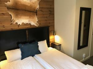 Postel nebo postele na pokoji v ubytování Kosta Lodge