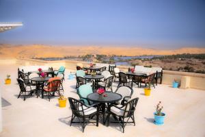 a group of tables and chairs on a patio at Basma Executive Club in Aswan