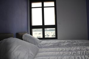 Postel nebo postele na pokoji v ubytování Appartement Devant la Mer
