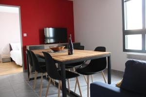 TV a/nebo společenská místnost v ubytování Appartement Devant la Mer