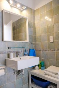 a bathroom with a sink and a mirror at Zero Zero 2 in Peyia