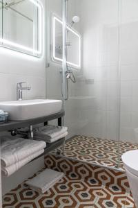 Koupelna v ubytování Domus Hotel-1