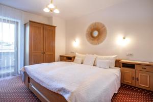 Postel nebo postele na pokoji v ubytování Gästehaus Appartement Höllwarth