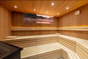 a sauna with a tv on the wall at Hotel Zeitgeist Vienna Hauptbahnhof in Vienna