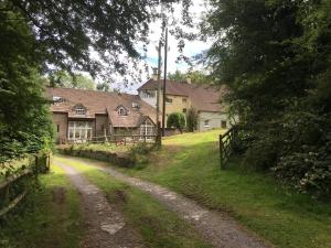 a dirt road in front of a house at Beautiful 6-Bed Home in Brecon in Brecon