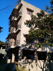 a building with a fire escape on the side of it at Belle-Vue Holiday Homes in Panchgani